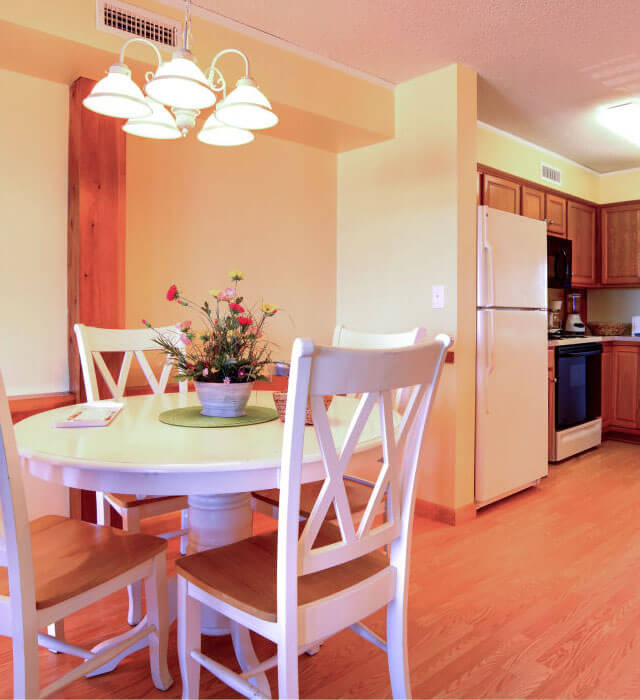 AO - Dining room and kitchen in Adams Ocean Front villa